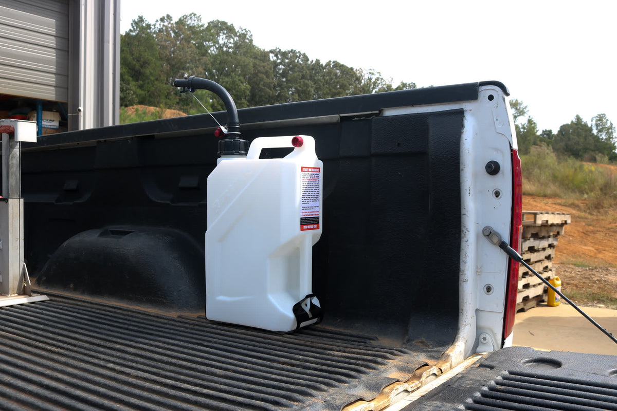 EZ Utility Jug locked into the EZ Floor Mount in a pickup truck bed