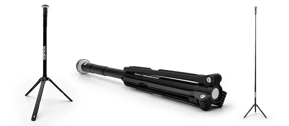 Black tripod stand light with adjustable legs on a white background